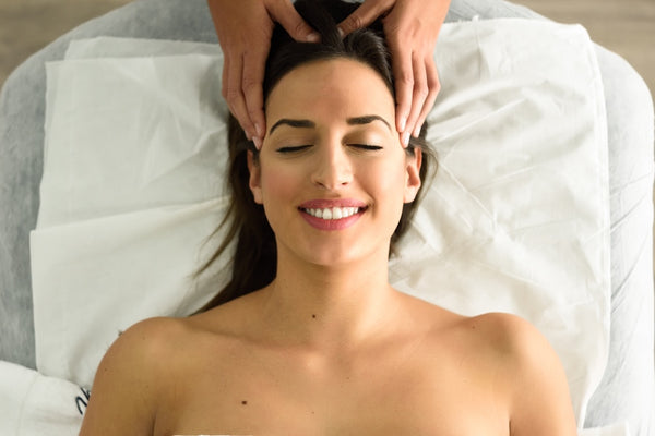 Woman getting a head massage