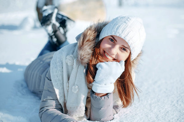 Woman playing in the snow