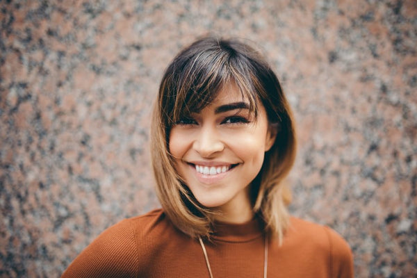 Smiling woman with naturally long lashes