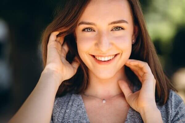 Smiling woman with glowing skin