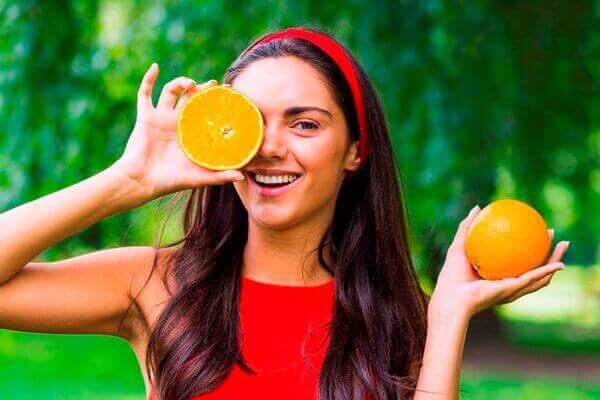 Woman holding orange