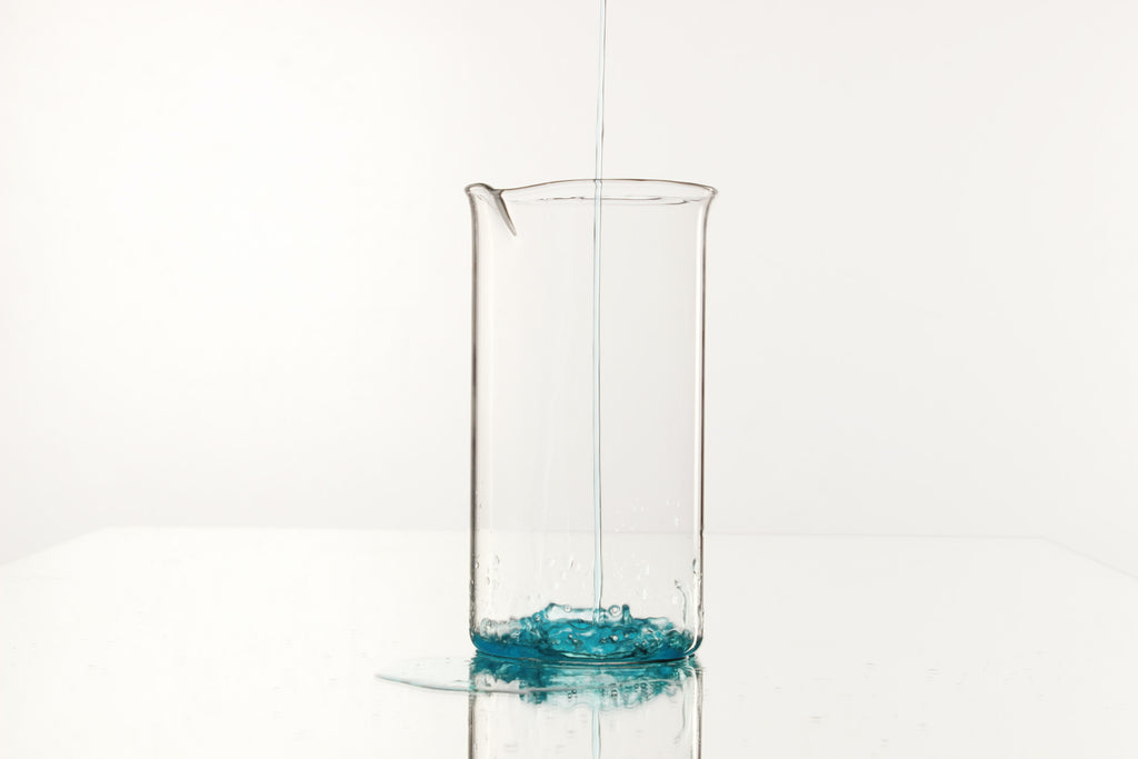 ph water solution beaker