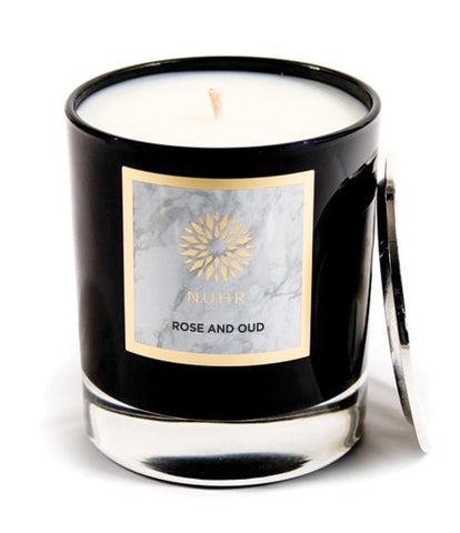 Rose and Oud Deluxe Candle with silver lid leaning on candle to side