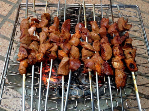 Liver on skewers over barbecue