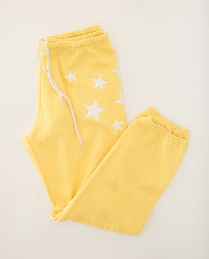 yellow sweatpants with white stars