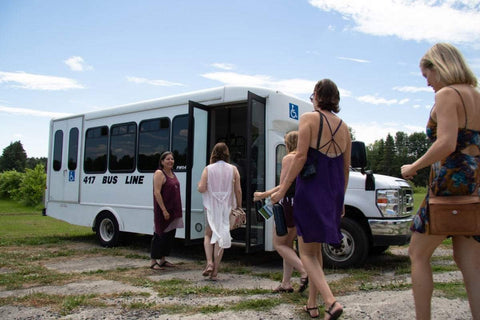 Guests board tour bus at Green Gables Vines winery in Eastern Ontario