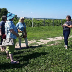 KIN Vineyard sommelier Alex Britton and La Vida Local food and wine tour guests