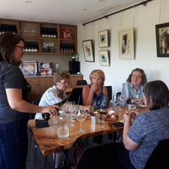La Vida Local wine tour guests taste Kin Vineyards wines.