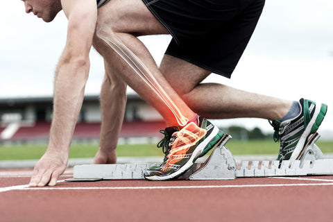Image showing a runner in the sprint position and illustrating in the leg where one would feel symptoms or pain from plantar fasciitis