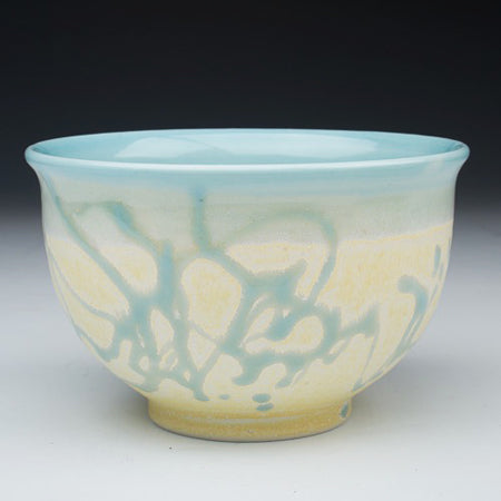 Classical and perfectly symmetrical in its form, a porcelain bowl by Chad Luberger takes on a modern look with its abstract glaze pattern.  (photo: Chad Luberger)