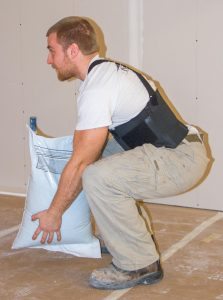 using proper lifting technique in a warehouse or construction job can prevent lower back pain