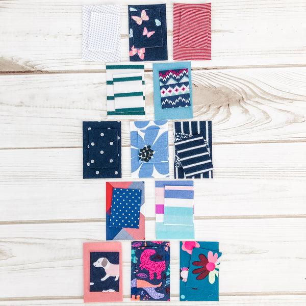 First year memory quilt made with baby onesies by Julie Burton of Running Stitch Quilts