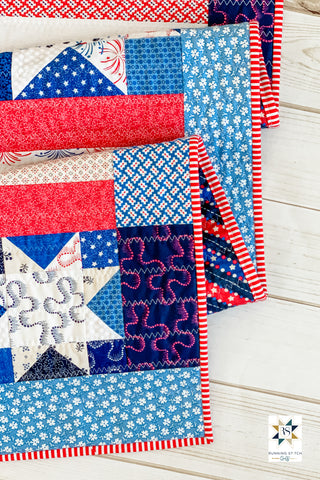 Snowflakes in July by Julie Burton of Running Stitch Quilts, the scrappy variation. 