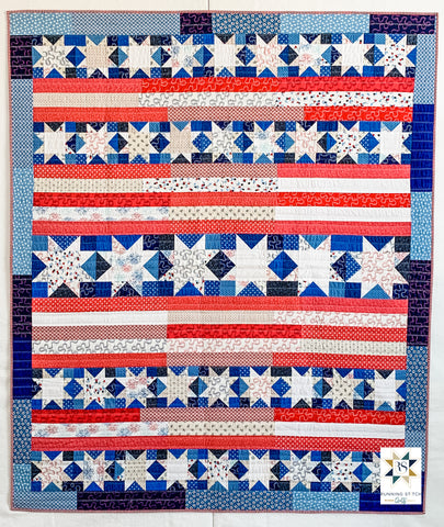 Snowflakes in July by Julie Burton of Running Stitch Quilts, the scrappy variation. 