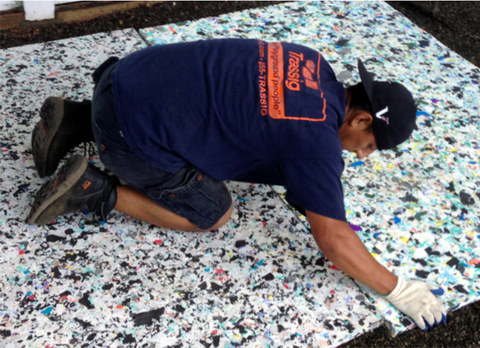 installing synthetic turf padding for a playground