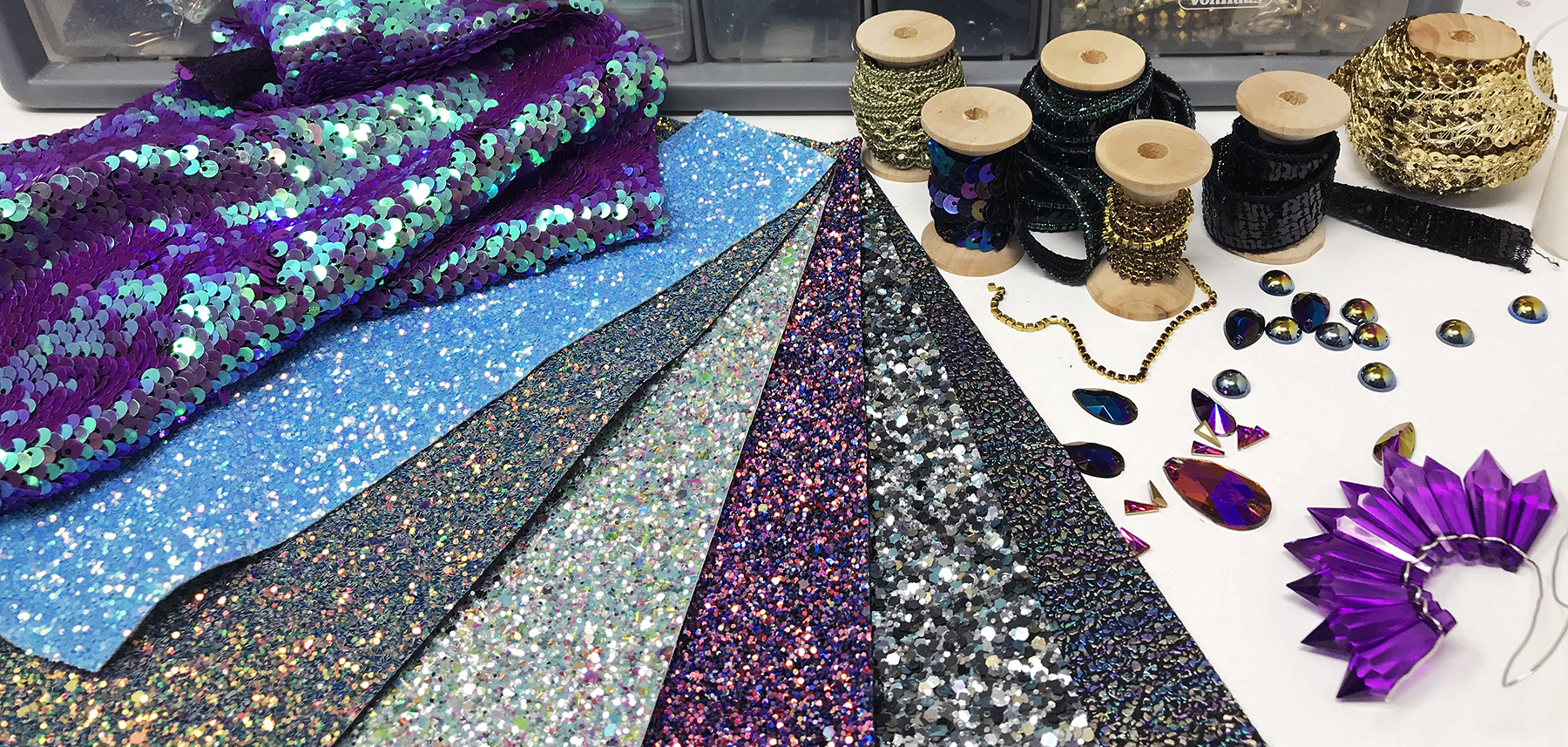 Glitter fabric, sequins, gemstones and crystals.