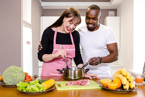 happy couple cooking together meal prep meal planning