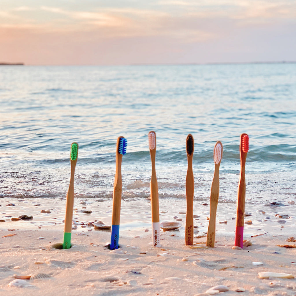 Sustainable Eco friendly Bamboo toothbrush on the beach