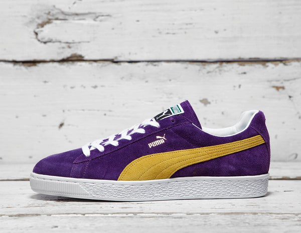 purple and yellow puma suedes