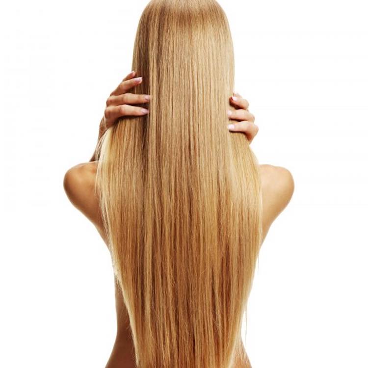 long blonde clip-ins hands in hair