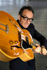 Elvis Costello swinging guitar