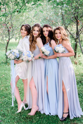 standing bride with her bridesmaids