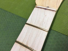 Close up of the freshly seated Jescar EVO frets