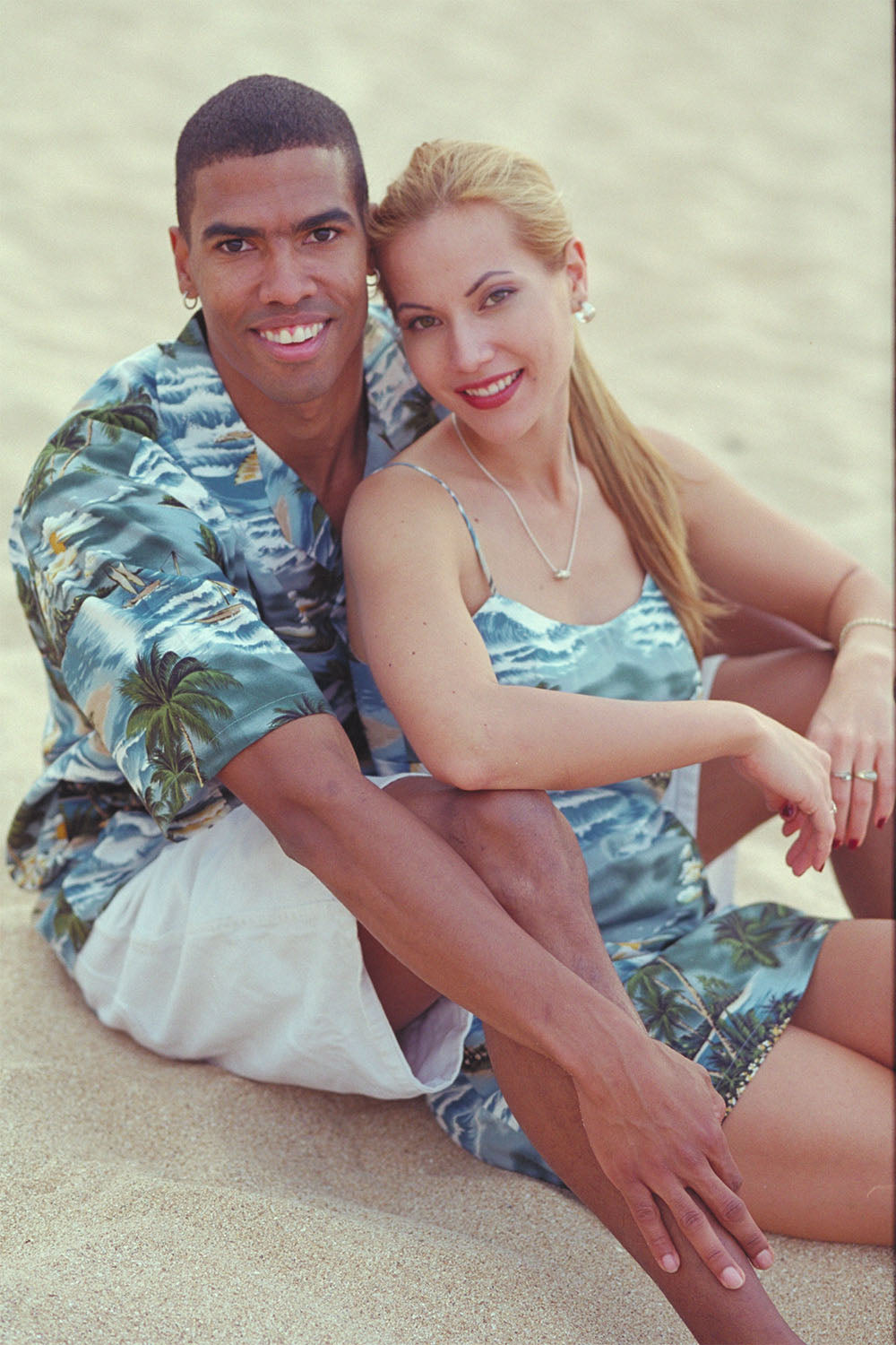 Casey and Angel in matching Hawaiian shirt and dress