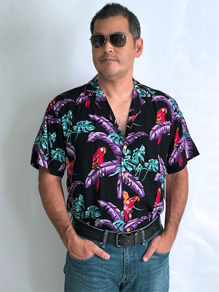Magnum PI shirt (black) tucked into blue jeans with belt