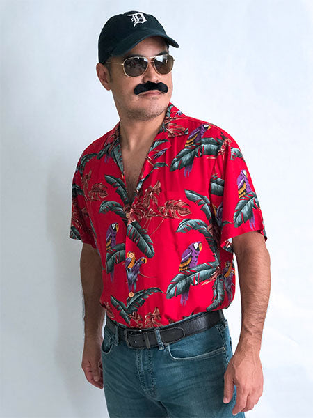 1980s Magnum PI outfit with red Hawaiian shirt, baseball cap, and mustache