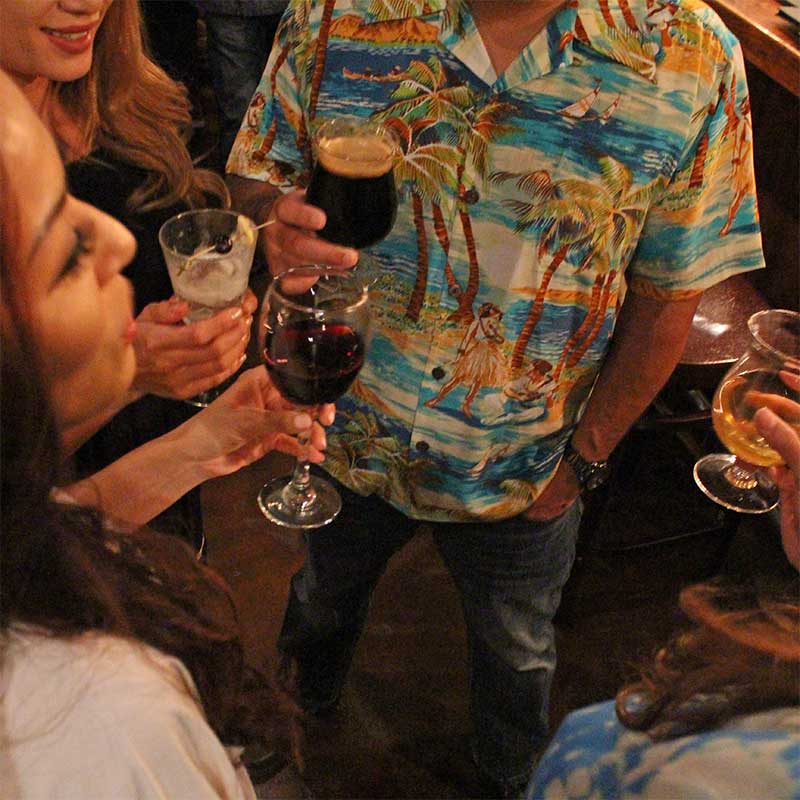 happy hour in a retro Hawaiian shirt and blue jeans