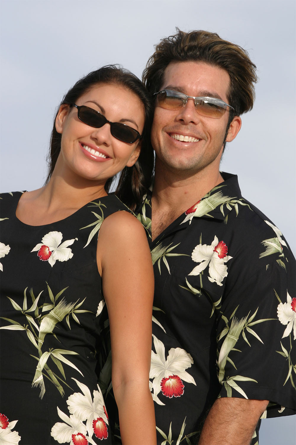 Sondra and Dave in Matching Black Bamboo Orchid Hawaiian Shirt and Dress