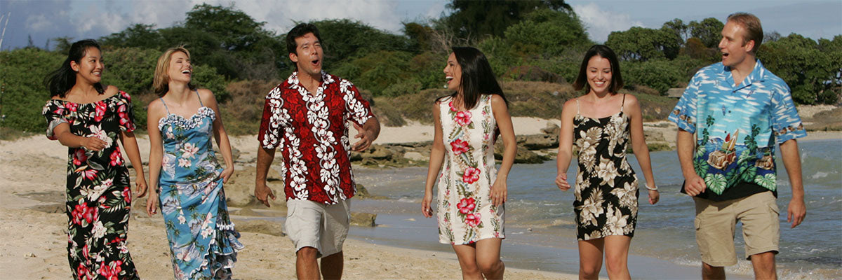 strolling on the beach in Hawaiian shirts and dresses