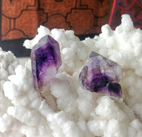 ic:These two extremely saturated amethyst specimens are from the Brandberg Area of Namibia.  "Brandbergs" are well known for their intense color zoning.