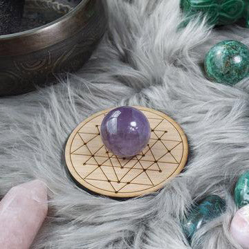 ic:Our grid boards are designed to hold spheres securely in the center of the board. A point or pyramid could also be placed over the cutout for the sphere