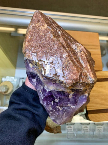 ic:This red capped Thunder Bay Amethyst is on display at Northern Maine Minerals.  While the top is clearly saturated with hematite, this is still considered amethyst do to its very purple stem.