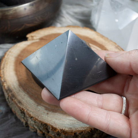 ic:It is estimated a Shungite pyramid of this size, 5cm, can absorb Electromagnetic Radiation in up to a 10 foot area around the pyramid.  It is best to set it directly next to the object giving off the radiation such as a Wireless router, microwave, or phone charger.