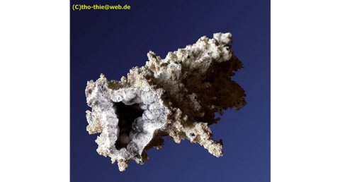 ic:Here is an example of a Fulgurite caused by an actual lightning strike occurrence.  In this case the quartz and glass in the sand is melted and fussed together by the intense heat creating a preserved tube of quartz and sand where the strike occurred.  Photo by Thomas Thieme.