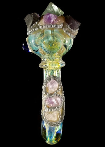 ic:Check out this pipe by Mile High Glass in Denver.  The pipe is hand blown glass with Fluorite and Amethyst as features on the outside of the glass bowl, a potentially safe alternative to incorporating crystals into your smoking rituals!