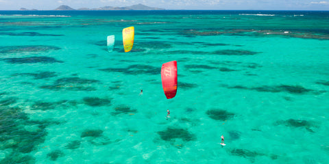 ocean with kites flying