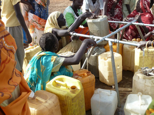 Gathering Water At Refugee Camp - Epimonia
