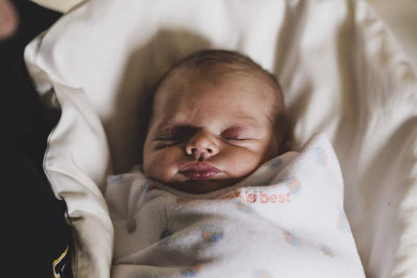sleeping infant on topponcino