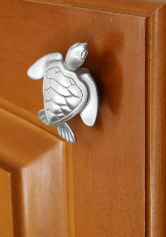 small turtle cabinet knob installed on door