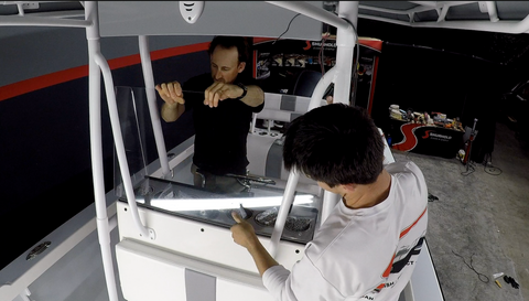 Two Men Installing Boat Windshield 