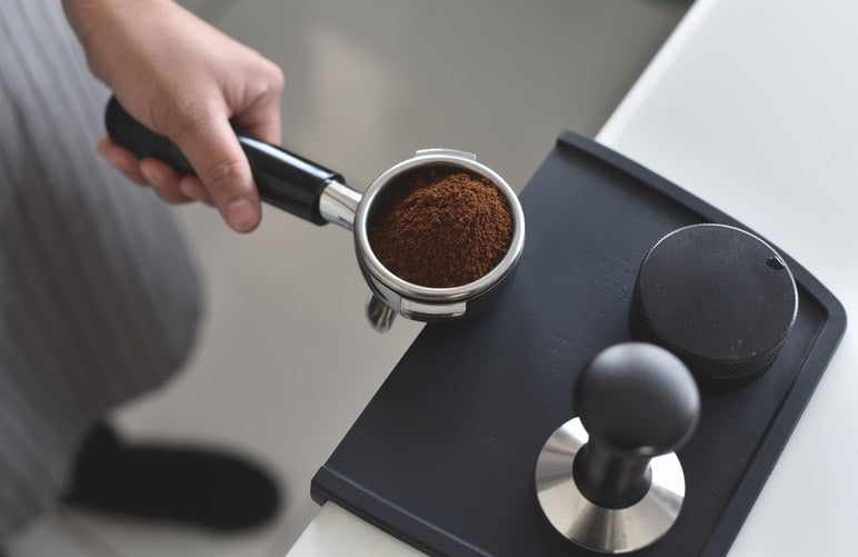 coffee grounds in an espresso maker