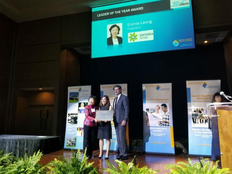 Emmie Leung, Founder and CEO of Emterra Group (left) is pictured on stage during the Canadian Plastics Industry Association awards accepting their Leader of the Year award.