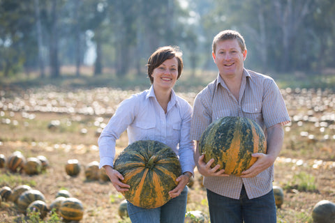 Sharan & Jay holding big pumpkins