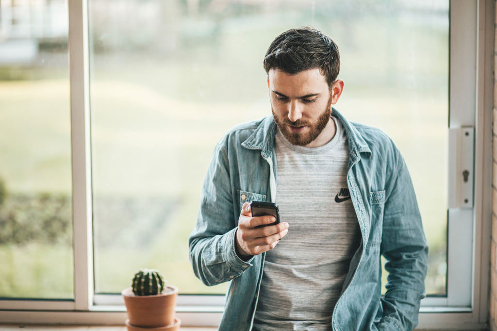 man looking at smartphone