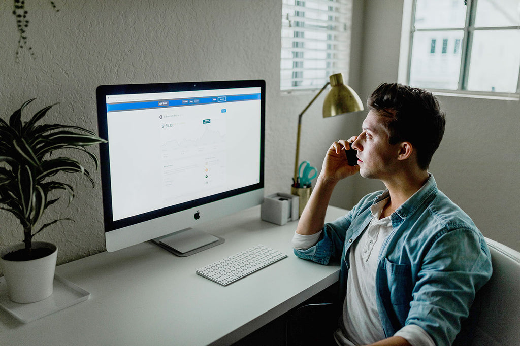 Man looking at bright screen in office