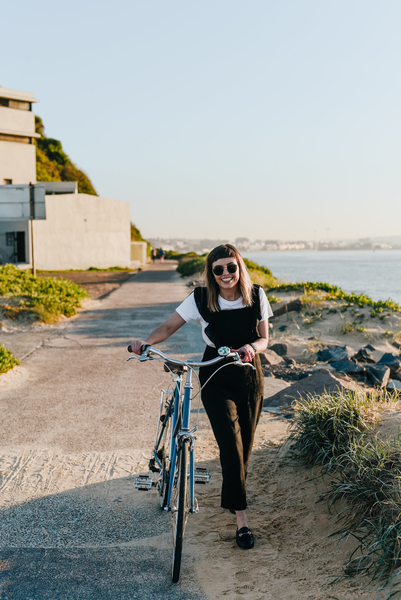 Girl walking with bike and beep bell